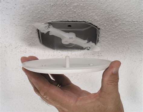 ceiling electric box cover blends in with ceiling|ceiling junction box not fully covered.